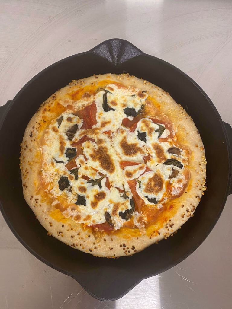 Enjoy the Bucket of Bread cast iron pan for pizza