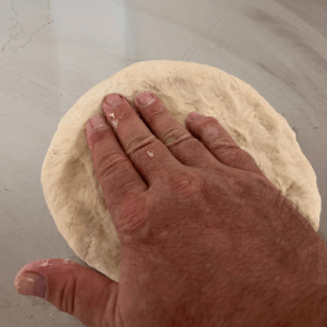 Flatten the dough ball for the Easy Autumn Apples and Spice Galette at Bucket of Bread