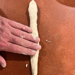 Old Bones Breadsticks rolling out bones for this Easy Halloween breadstick recipe